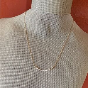 Tiffany “Small Smile” rose gold & diamond necklace.